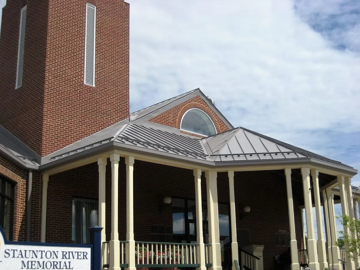 Skilled roofing craftsmen working on a residential roof in Monmouth Hills
